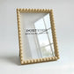 Beige modular frame with 'POSTERED' branding on a white background