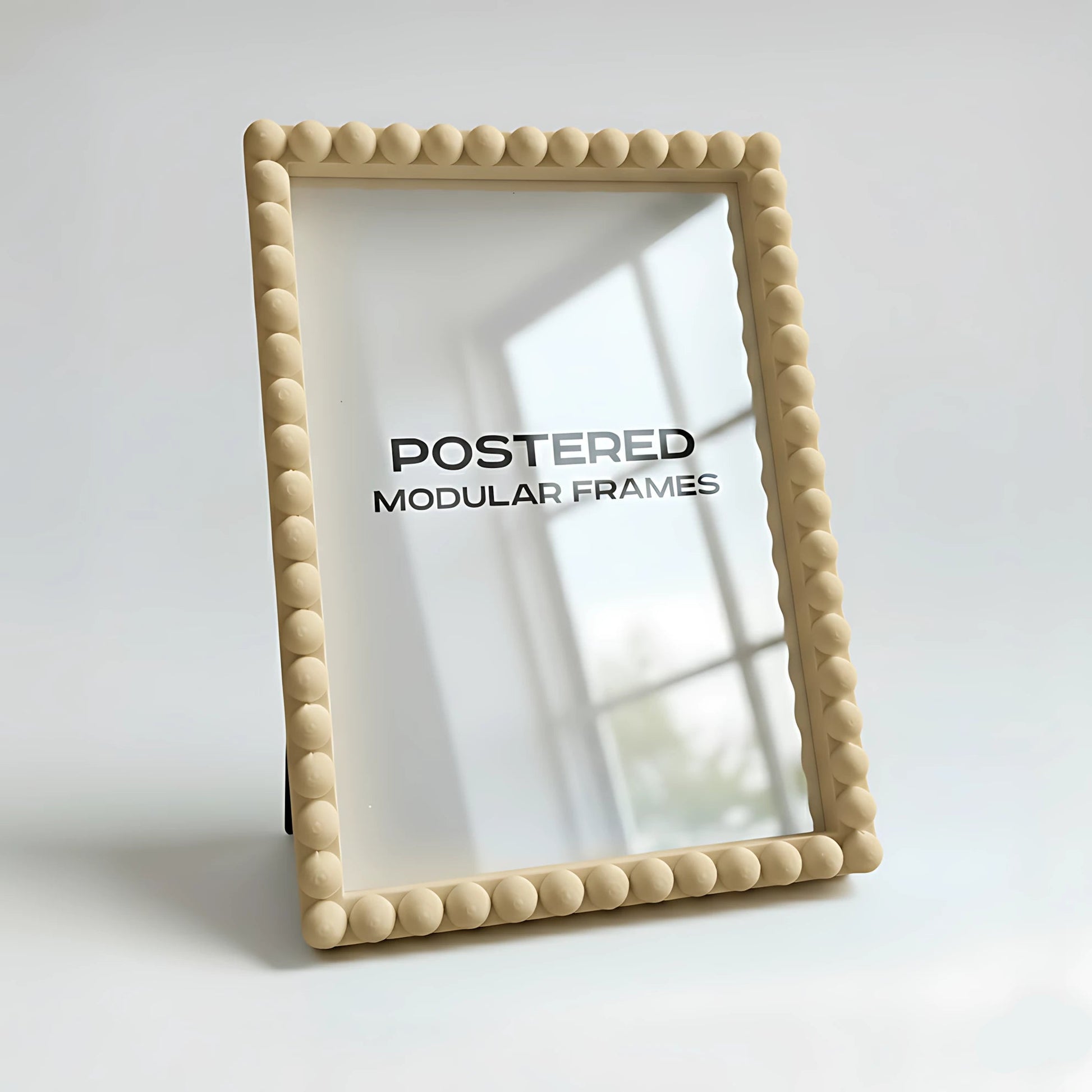 Beige modular frame with 'POSTERED' branding on a white background