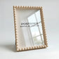 Beige framed mirror with 'POSTERED MODULAR FRAMES' branding on a light background