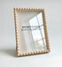 Beige framed mirror with &