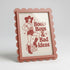 Framed poster with a graphic of a woman in a cowboy hat and boots, text &