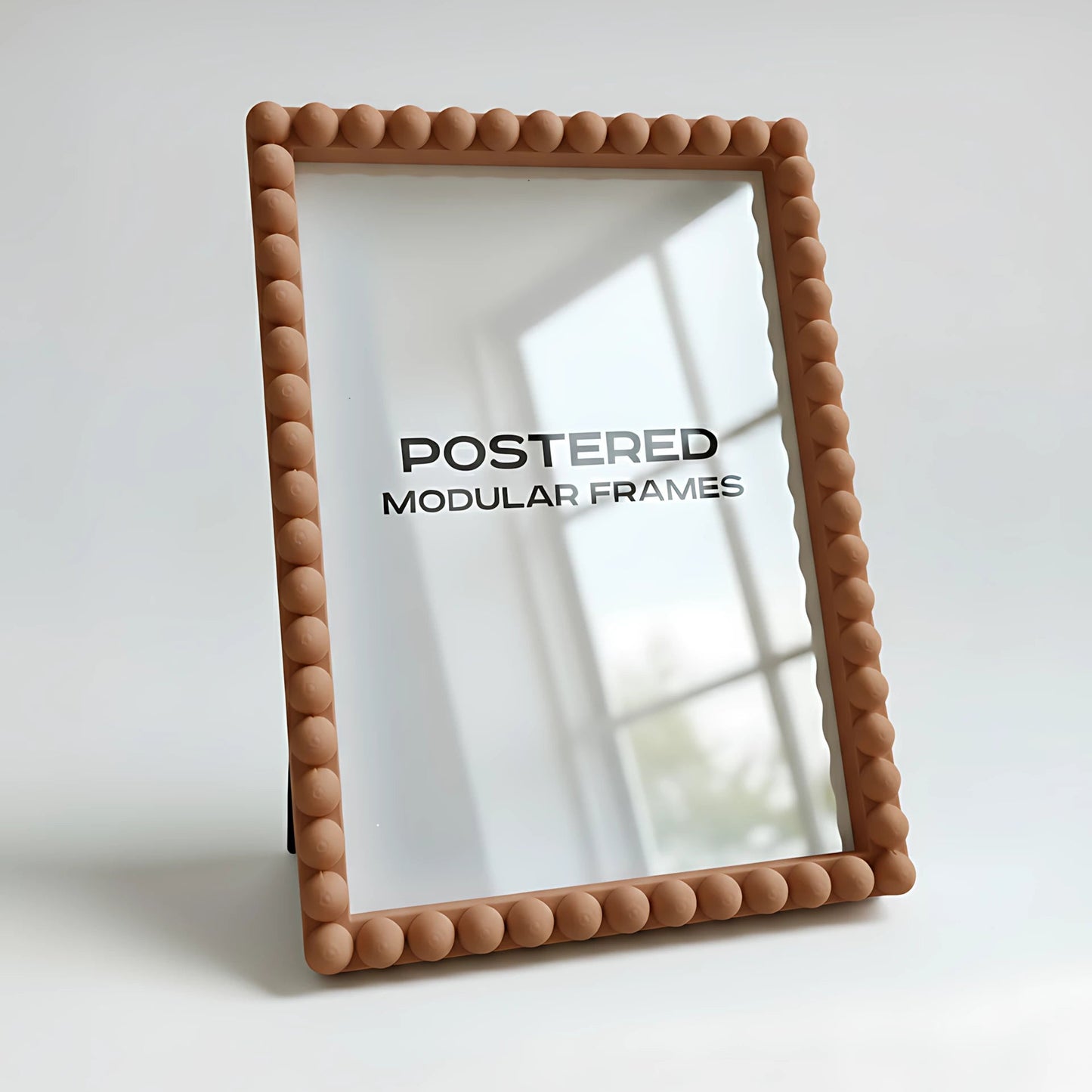 Beige framed mirror with 'POSTERED MODULAR FRAMES' text on a white background