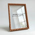 Beige framed mirror with &