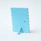 Light blue silicone ice cube tray on a white background