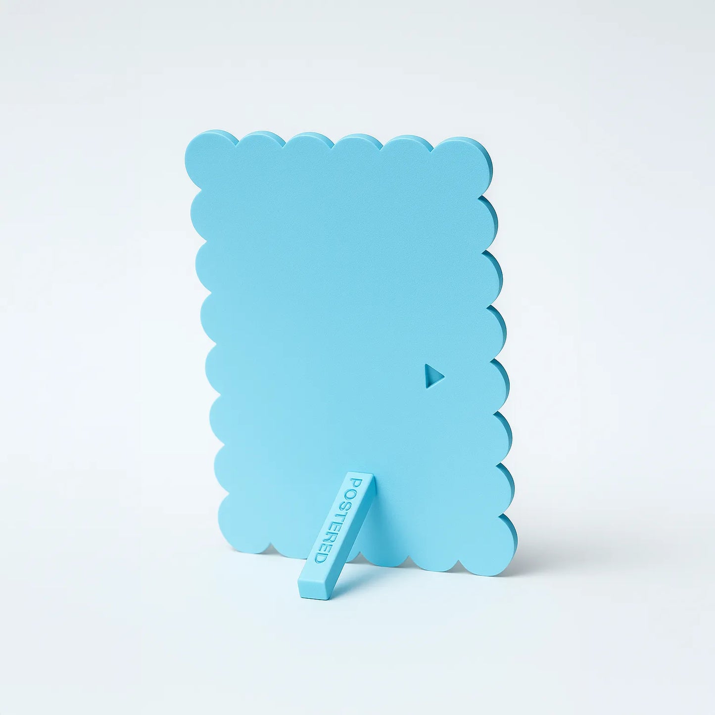 Light blue silicone ice cube tray on a white background