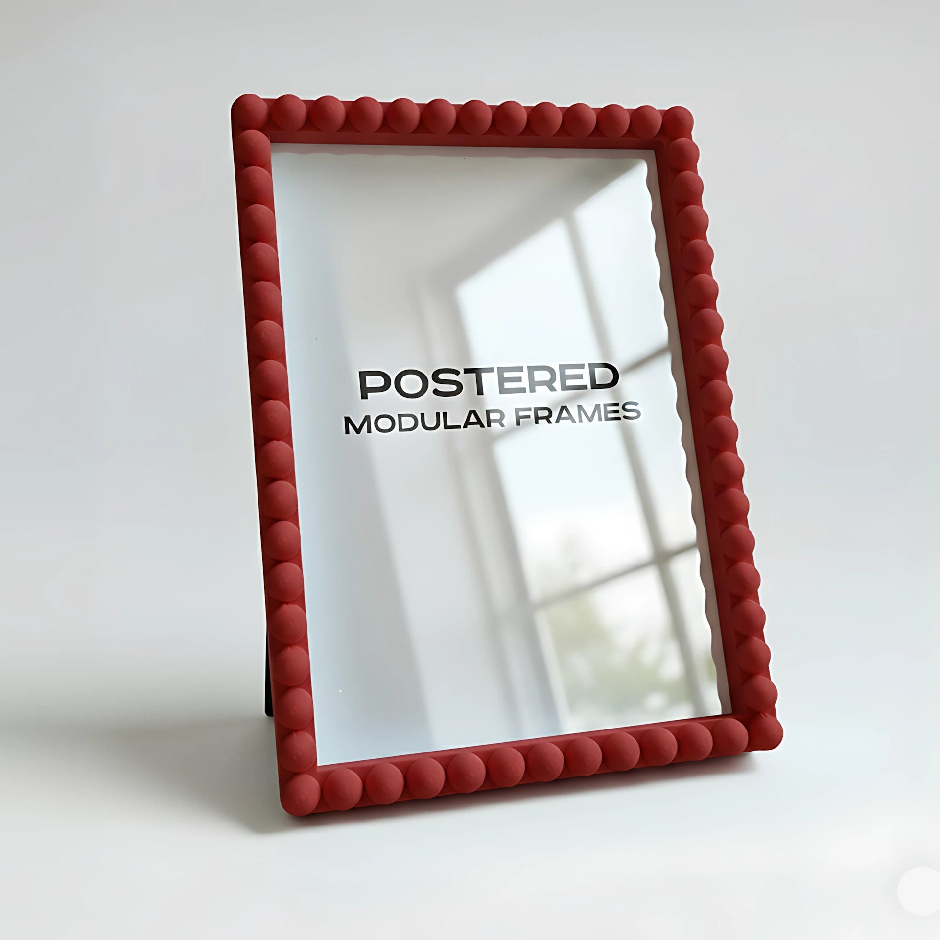 Red modular frame with 'POSTERED' branding on a white background